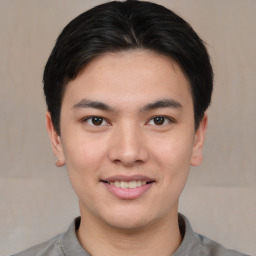 Joyful asian young-adult male with short  black hair and brown eyes