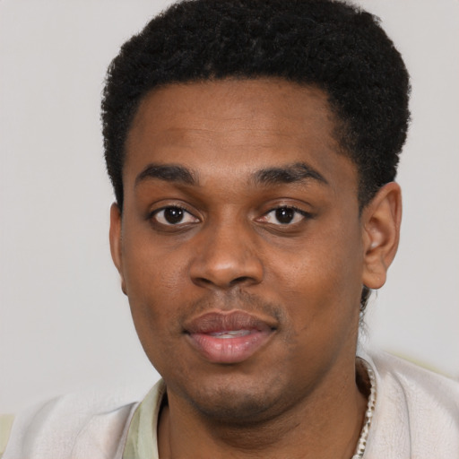 Neutral black young-adult male with short  black hair and brown eyes