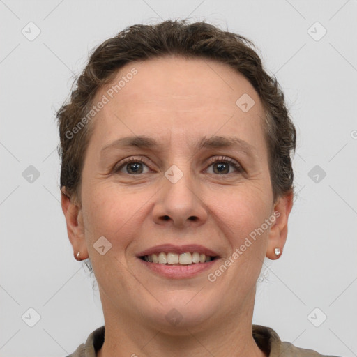 Joyful white adult female with short  brown hair and grey eyes