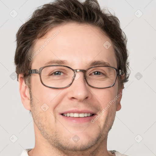 Joyful white adult male with short  brown hair and grey eyes