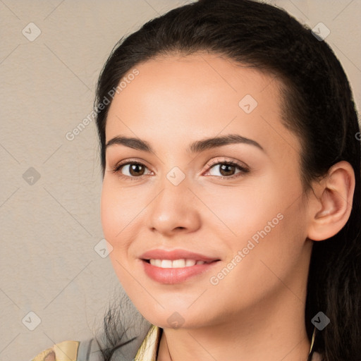 Joyful white young-adult female with long  black hair and brown eyes