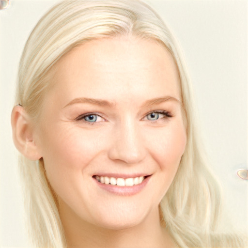 Joyful white young-adult female with long  blond hair and blue eyes