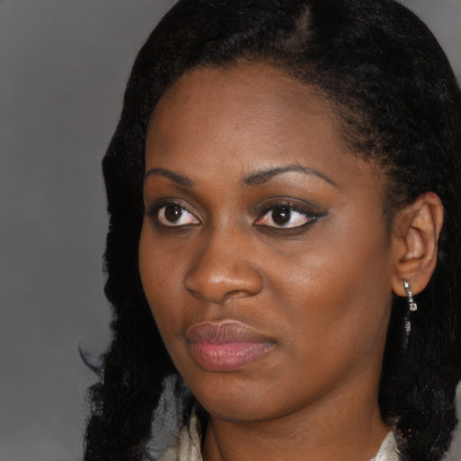 Neutral black young-adult female with long  black hair and brown eyes