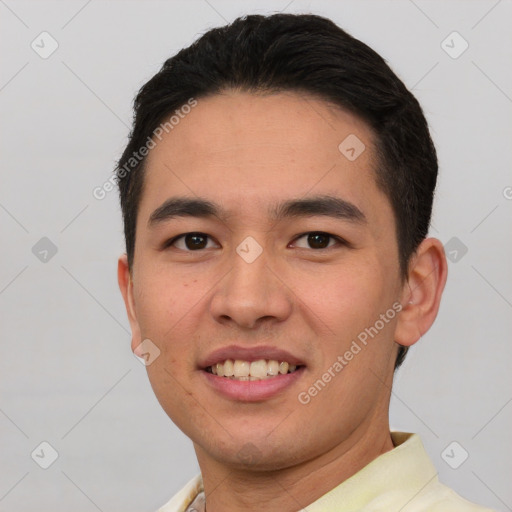 Joyful asian young-adult male with short  black hair and brown eyes