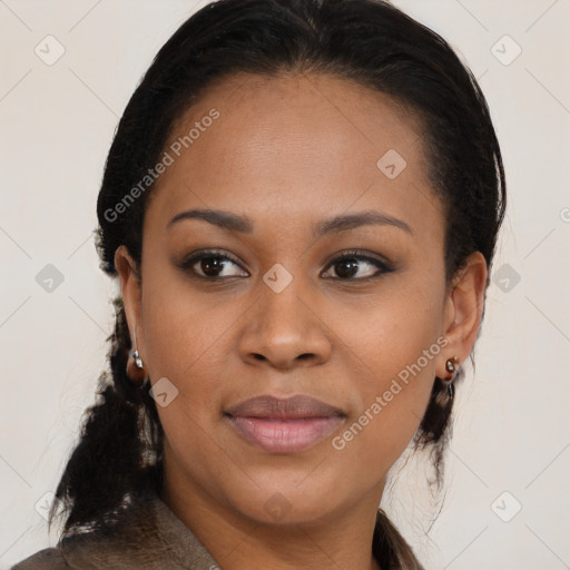 Joyful black young-adult female with long  brown hair and brown eyes