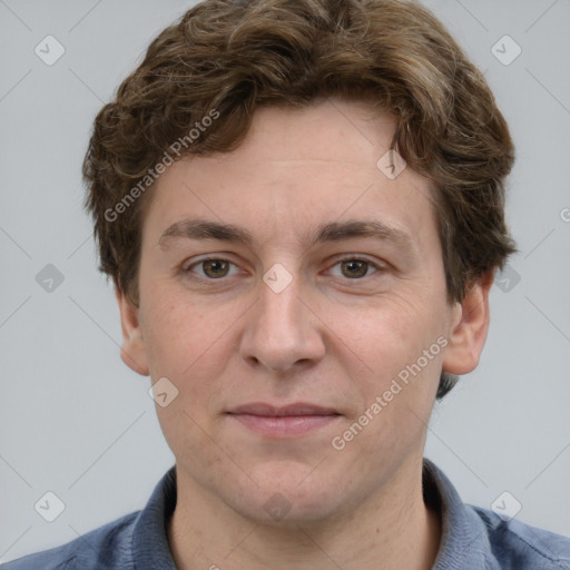 Joyful white adult male with short  brown hair and grey eyes