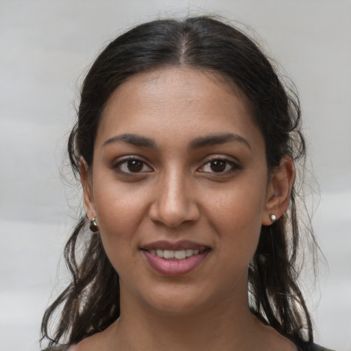 Joyful white young-adult female with medium  brown hair and brown eyes