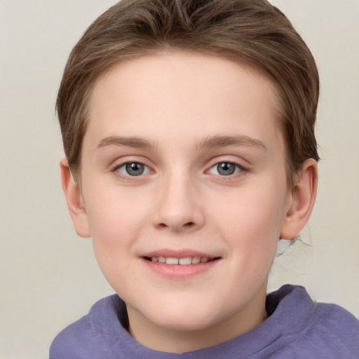 Joyful white child female with short  brown hair and grey eyes