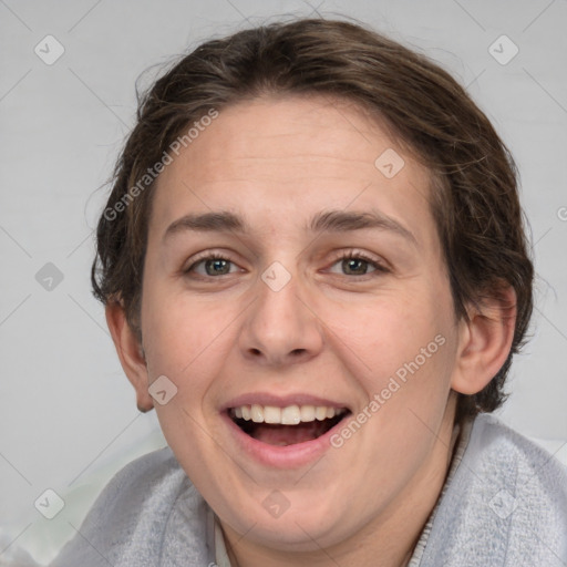 Joyful white adult female with short  brown hair and grey eyes