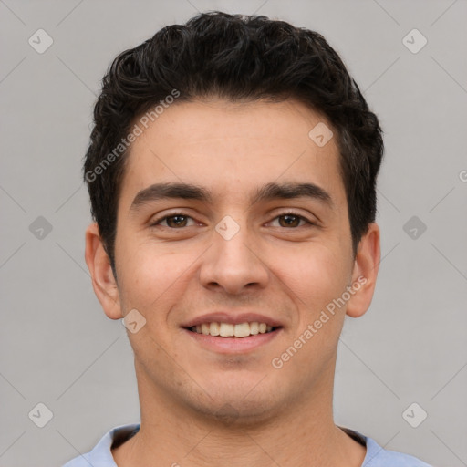 Joyful white young-adult male with short  black hair and brown eyes