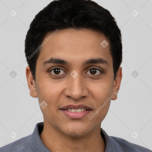 Joyful latino young-adult male with short  black hair and brown eyes