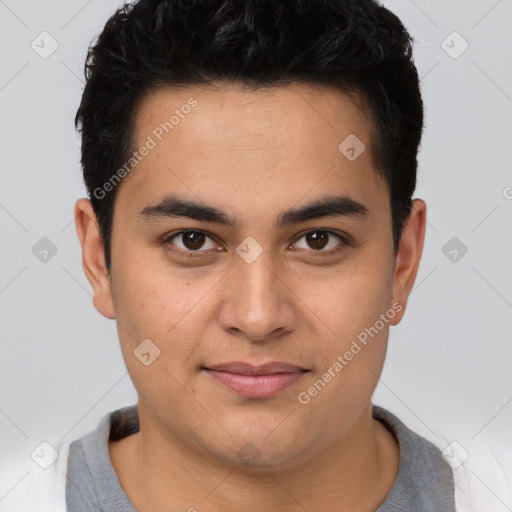 Joyful latino young-adult male with short  brown hair and brown eyes