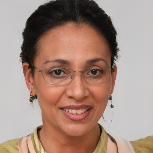 Joyful latino adult female with short  brown hair and brown eyes