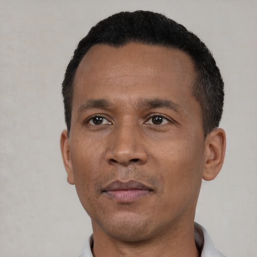 Neutral black adult male with short  black hair and brown eyes