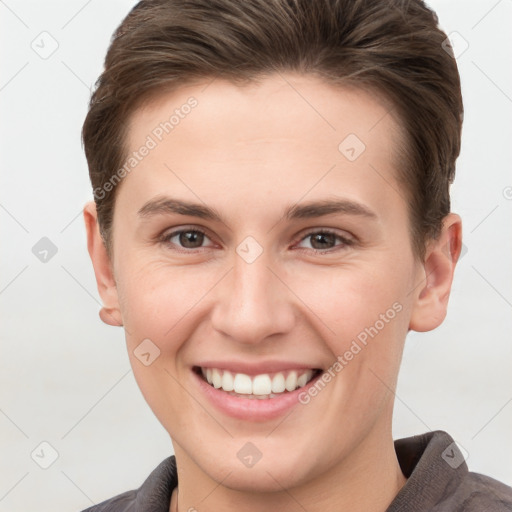 Joyful white young-adult female with short  brown hair and grey eyes