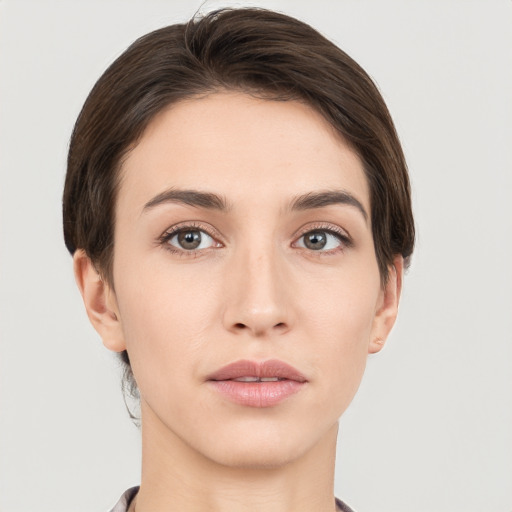 Neutral white young-adult female with short  brown hair and brown eyes