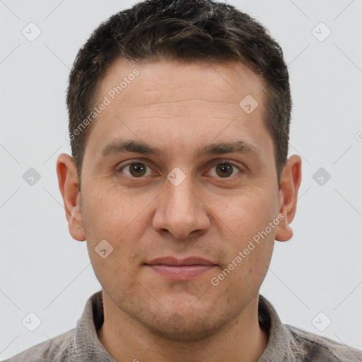 Joyful white adult male with short  brown hair and brown eyes