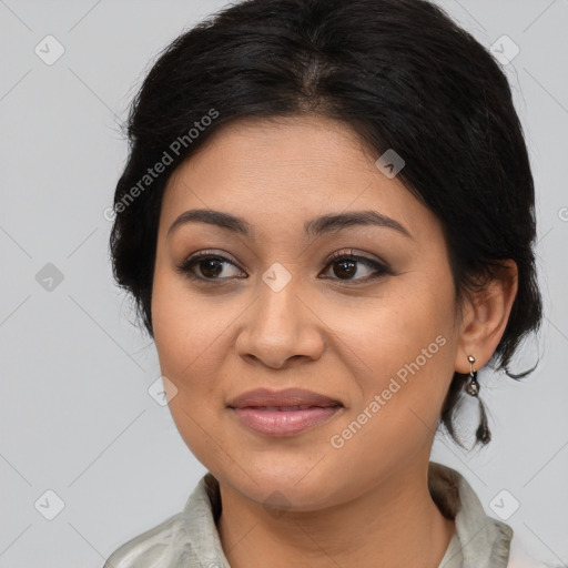 Joyful latino young-adult female with medium  brown hair and brown eyes