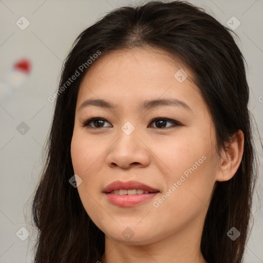 Joyful asian young-adult female with long  brown hair and brown eyes