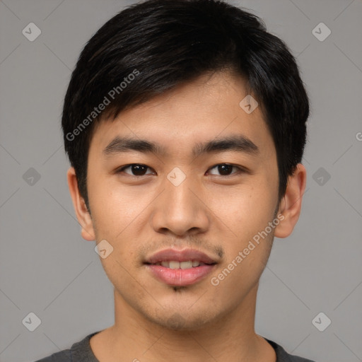 Joyful asian young-adult male with short  black hair and brown eyes