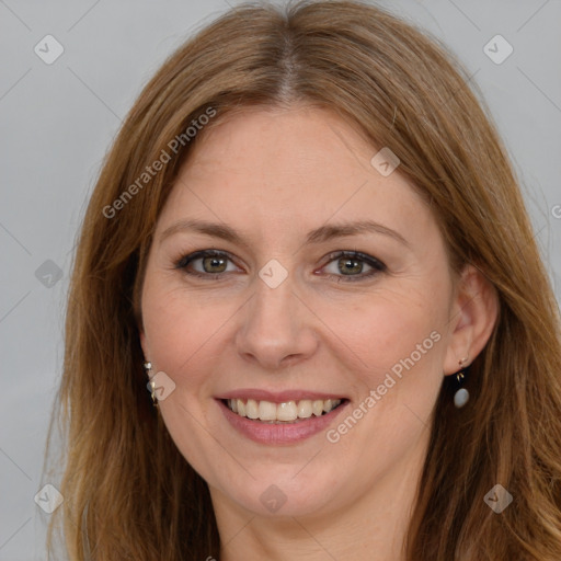 Joyful white adult female with long  brown hair and brown eyes