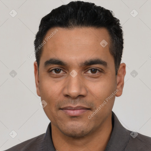 Joyful latino young-adult male with short  black hair and brown eyes