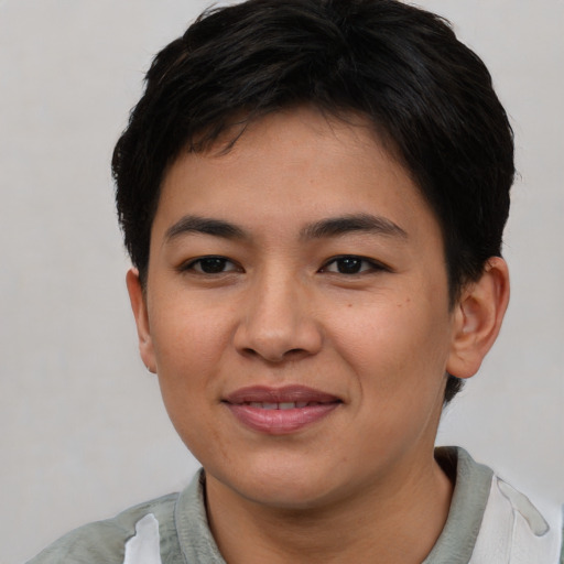 Joyful asian young-adult female with short  brown hair and brown eyes