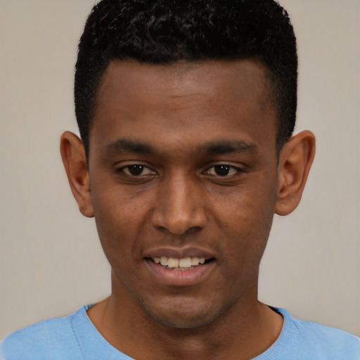 Joyful black young-adult male with short  brown hair and brown eyes