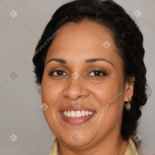 Joyful latino adult female with long  brown hair and brown eyes