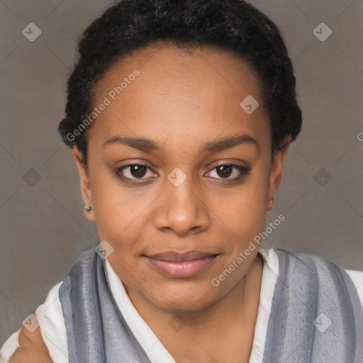 Joyful black young-adult female with short  black hair and brown eyes