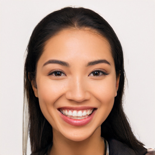 Joyful latino young-adult female with long  brown hair and brown eyes