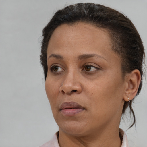 Neutral black young-adult female with short  brown hair and brown eyes