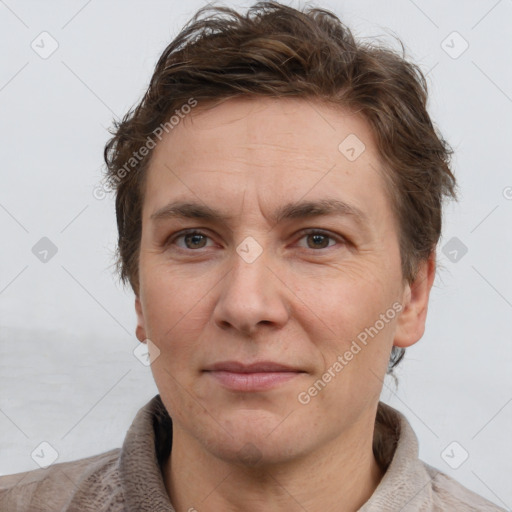 Joyful white adult male with short  brown hair and grey eyes