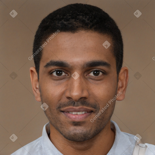 Joyful black young-adult male with short  black hair and brown eyes