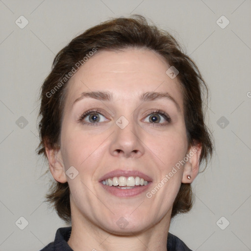 Joyful white adult female with medium  brown hair and blue eyes