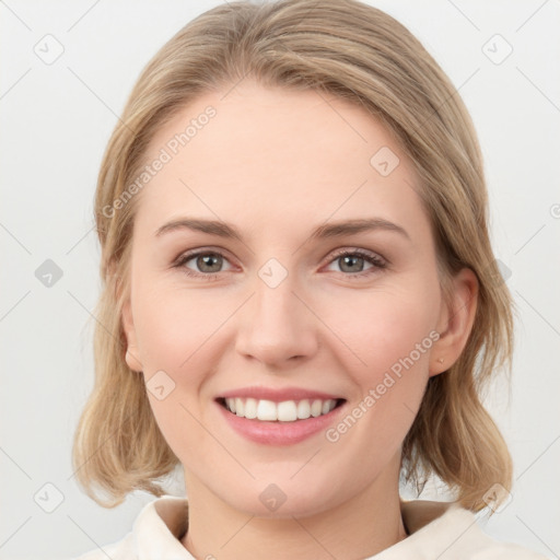 Joyful white young-adult female with medium  brown hair and blue eyes