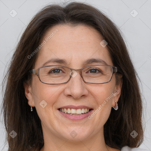 Joyful white adult female with medium  brown hair and grey eyes