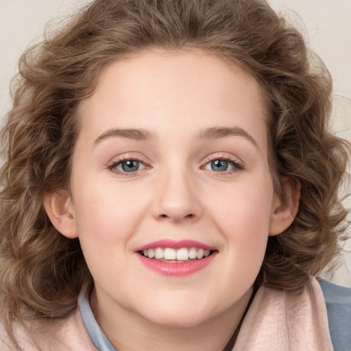 Joyful white child female with long  brown hair and blue eyes