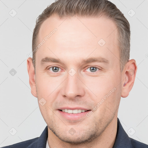 Joyful white adult male with short  brown hair and grey eyes