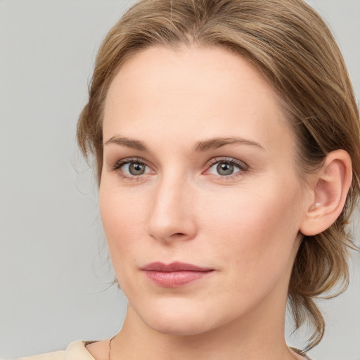 Joyful white young-adult female with medium  brown hair and blue eyes