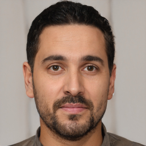 Neutral white young-adult male with short  black hair and brown eyes