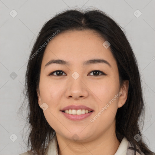 Joyful asian young-adult female with long  brown hair and brown eyes