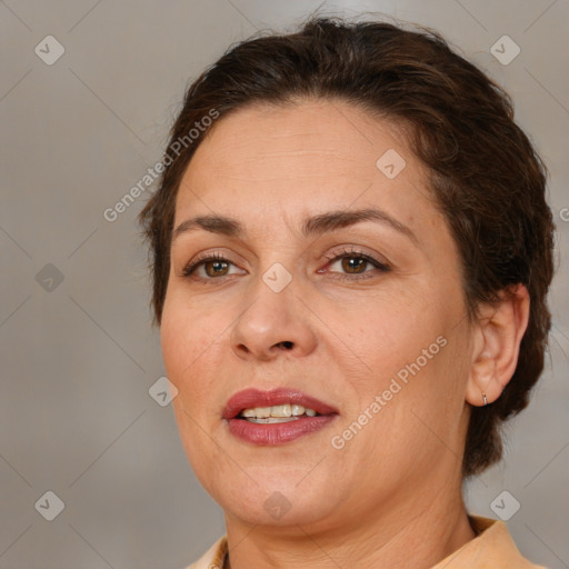 Joyful white adult female with medium  brown hair and brown eyes