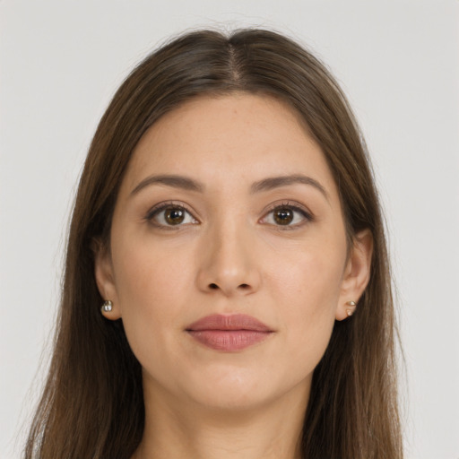 Joyful white young-adult female with long  brown hair and brown eyes