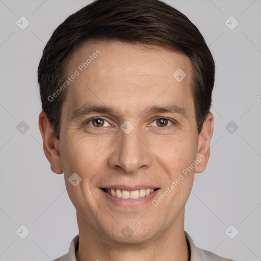 Joyful white adult male with short  brown hair and grey eyes