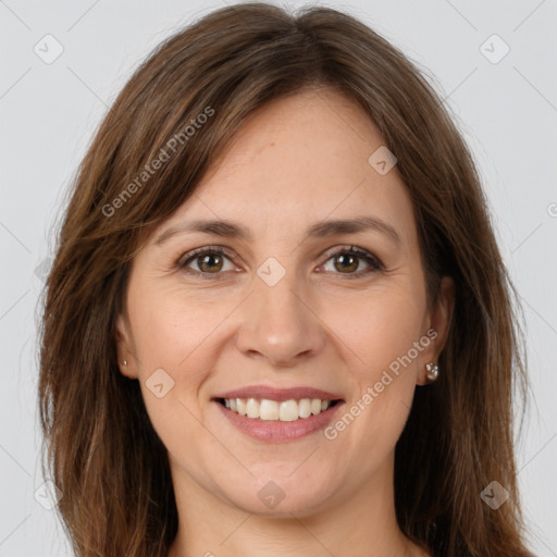 Joyful white young-adult female with long  brown hair and green eyes