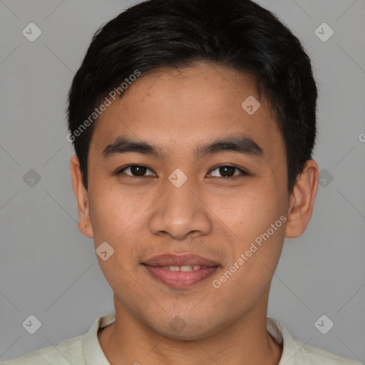 Joyful asian young-adult male with short  brown hair and brown eyes