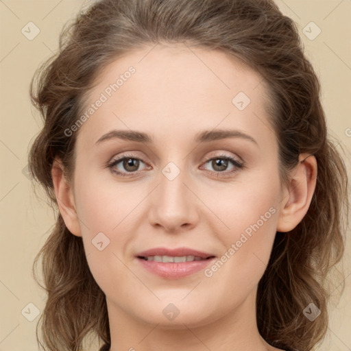 Joyful white young-adult female with long  brown hair and green eyes