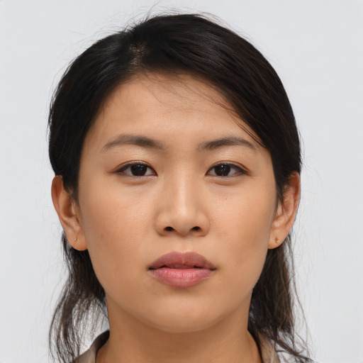Neutral asian young-adult female with medium  brown hair and brown eyes