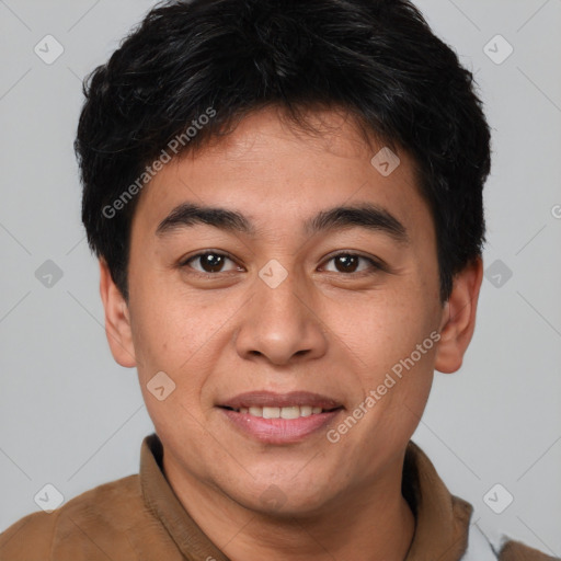 Joyful asian young-adult male with short  brown hair and brown eyes